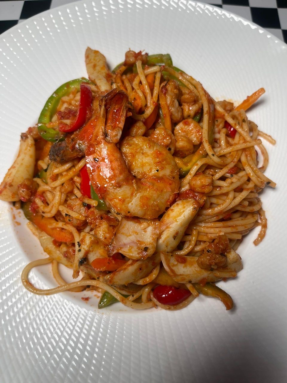 Seafood spaghetti in tomato sauce